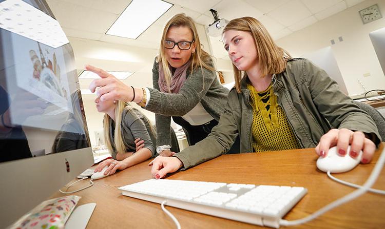 Student designing on a computer